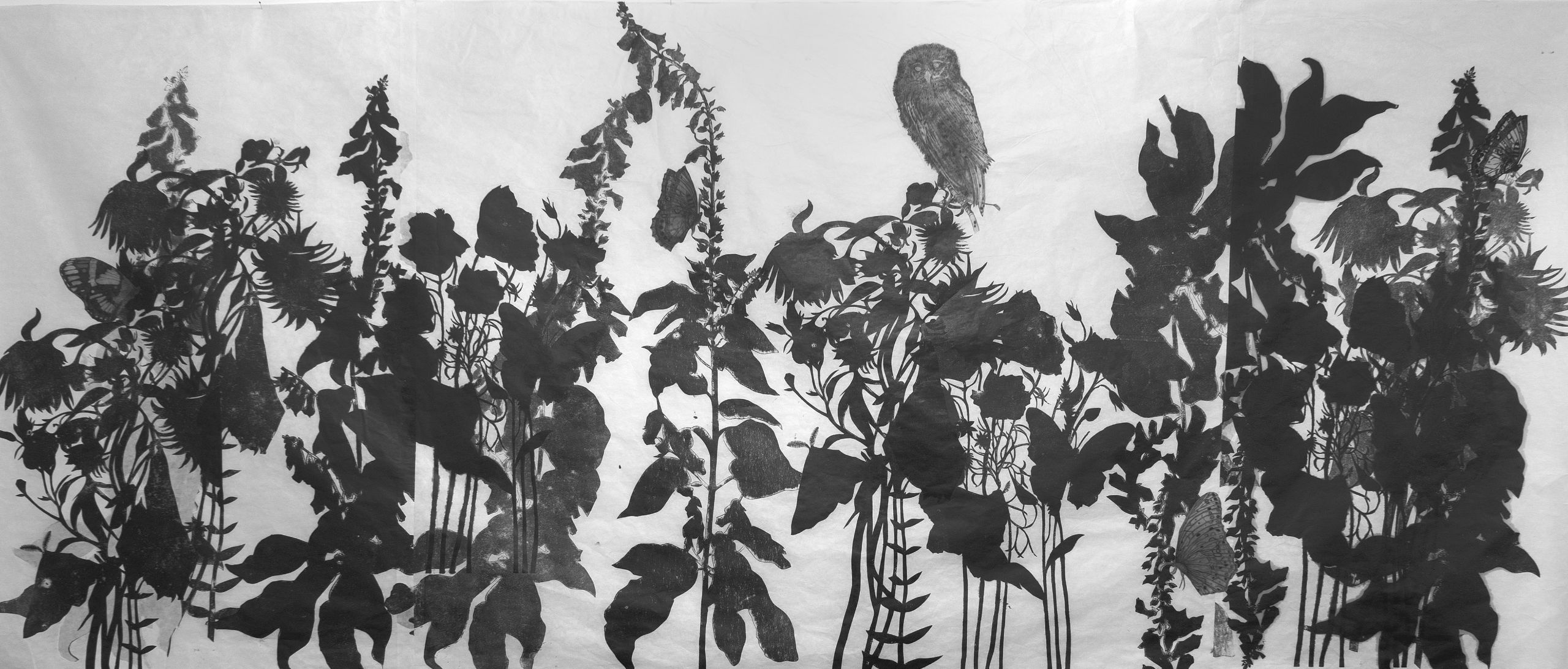 Black and white print of foliage.